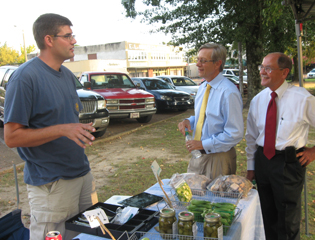 Photo of ARC Federal Co-Chair Earl Gohl and ARC Federal Office Chief of Staff Guy Land with a participating vendor during a visit to to Calhoun Countys Bruce Farmers Market as part of ARC's Mississippi Jobs and Local Food Systems Tour.