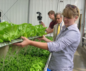 Photo of ARC Federal Co-Chair Earl Gohl and Finger Lakes Fresh staffers Liz Keyser and Curran McKee during a visit to the Finger Lakes Fresh hydroponics greenhouse in Ithaca, New York, on June 27, 2013.