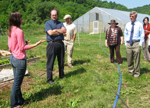 Photo of Ohio Jobs and Local Food Systems Tour participants at Greed Edge Gardens, a family-owned organic farm in Amesville.